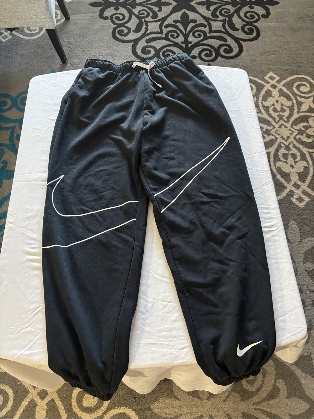 Nike Black Jogger Sweatpants with White Swoosh Graphics
